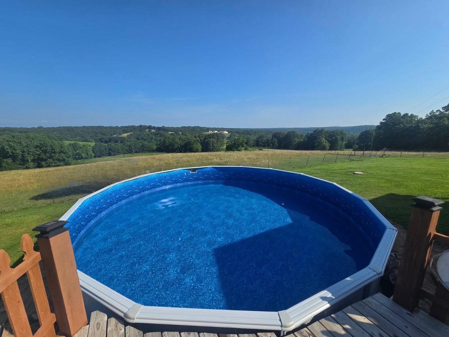 Happy family enjoying their backyard pool
